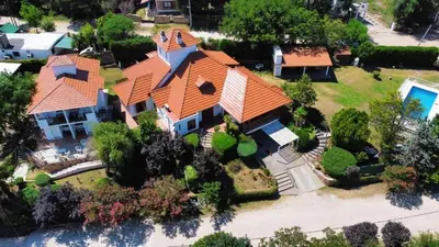 an overhead view of a house with an orange roof at Cabanas Las Pencas, HOSTERIA in Mina Clavero