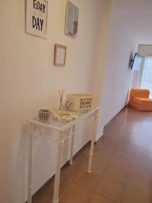 a white table with a box on it in a room at Olmos Córdoba Apart in Cordoba