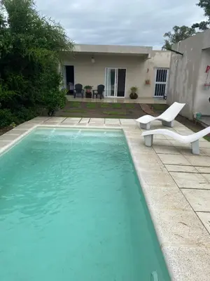 a swimming pool in front of a house at lo de lucio in Almafuerte