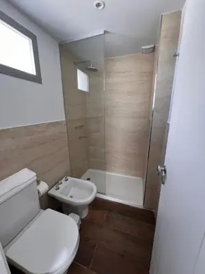 a bathroom with a toilet and a sink and a shower at Departamentos en Barrio Gral Paz a pocos metros de clínicas in Cordoba