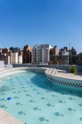a large swimming pool on the roof of a building at Departamento 3 Paris - Edificio VILAUT by INMOVE Temporarios in Cordoba