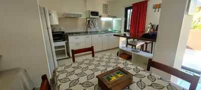 a kitchen with a table with a box on it at Oasis depto en centro carlos paz in Villa Carlos Paz