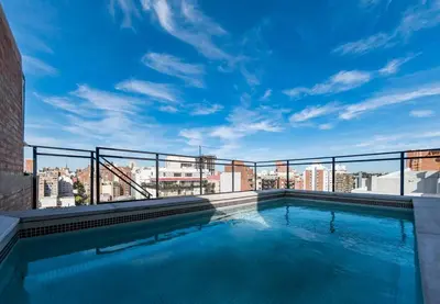 a swimming pool on the roof of a building at Loft en Güemes Piso 9 in Cordoba