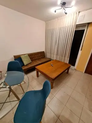 a living room with a couch and a table and chairs at Exclusivo Departamento en Nva Cba!!! in Cordoba