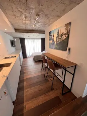 a kitchen with a table and chairs in a room at De lo mejor en Barrio General Paz in Cordoba