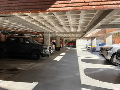 a parking garage with cars parked in it at De lo mejor en Barrio General Paz in Cordoba