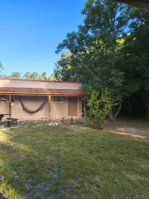 a house with a yard in front of it at Dormis Clave de Sol -dos in Villa Ciudad Parque