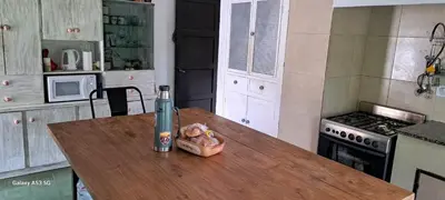 a table in a kitchen with a can on it at CASA de Campo EL LULY in La Bolsa