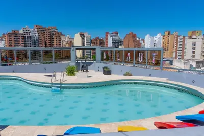 a large swimming pool on the roof of a building at Departamento 611 - Edificio VILAUT by INMOVE Temporarios in Cordoba