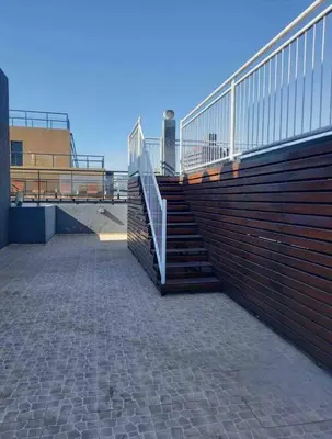 a set of stairs with a railing on a building at Depto carlos paz in Villa Carlos Paz