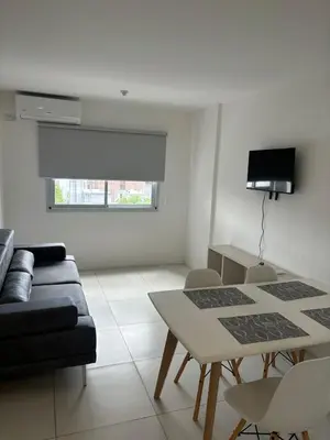 a living room with a couch and a table at Departamento para dos personas in Cordoba