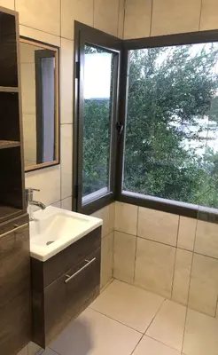 a bathroom with a sink and a window at Terra Bella in San Antonio de Arredondo