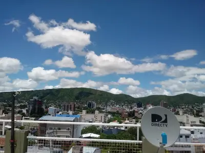 a view of a city from a balcony at Carlos paz tower in Villa Carlos Paz