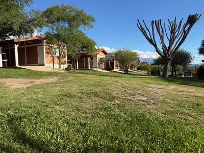 an empty yard in front of a house at Cabañas AdamiS in Villa Cura Brochero