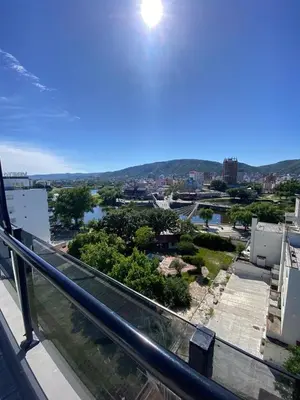 a view of a city from a balcony at Departamento centrico en carlos paz in Villa Carlos Paz