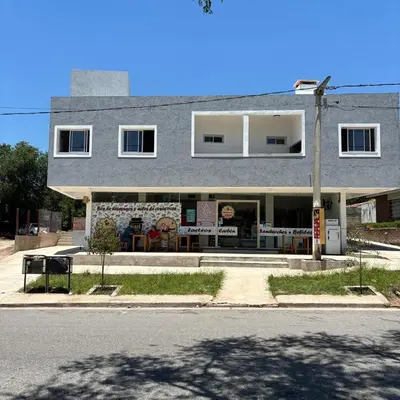 a building on the side of a street at Complejo playa de oro 3 in Villa Carlos Paz