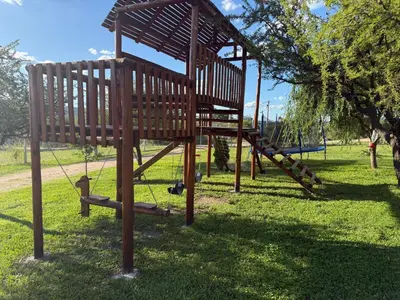 a park with a woodenvisedvisedvisedvisedvisedvisedvisedvisedvisedvisedfficient at Cabañas AdamiS 2 in Villa Cura Brochero