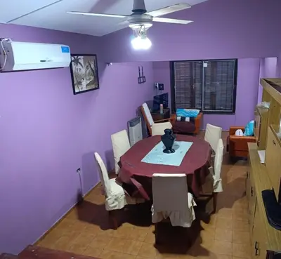 a dining room with a table and chairs at Chalet BERNI in Villa Carlos Paz