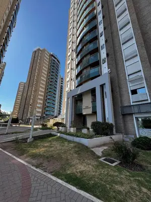 a building with two tall buildings in a city at Beautiful apartment in Cordoba