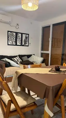 a dining room with a table and some chairs at Brisas Rumipal Dúplex Premium in Villa Rumipal