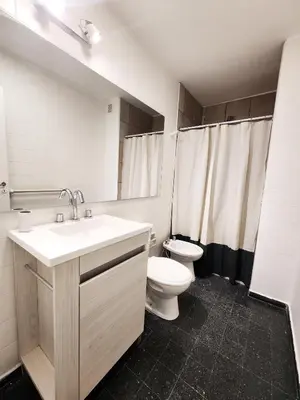 a bathroom with a sink and a toilet in it at Dpto Ituzaingo 1270 - 2 dormitorios in Cordoba