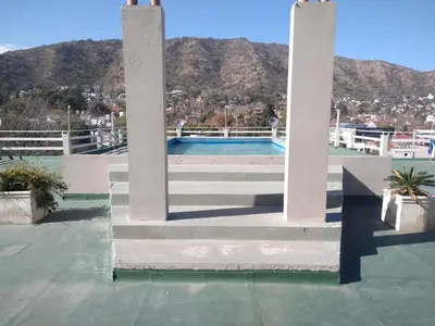 a view of a pool from the roof of a house at Deptos Carlos Paz B in Villa Carlos Paz