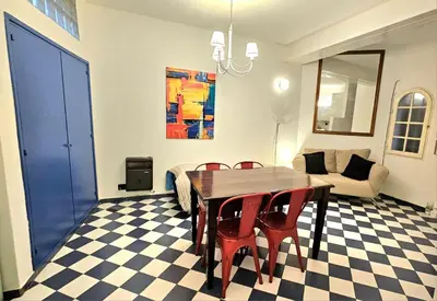 a dining room with a table and chairs and a couch at Crin Blanca in Cordoba