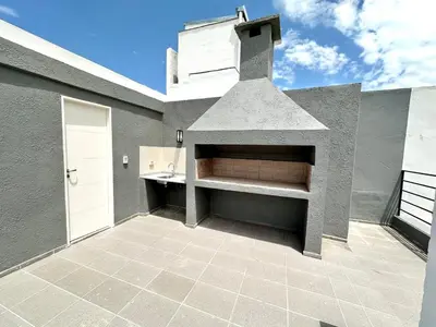 a kitchen with a pizza oven on the side of a building at Alojamiento entero para 2 personas E in Cordoba