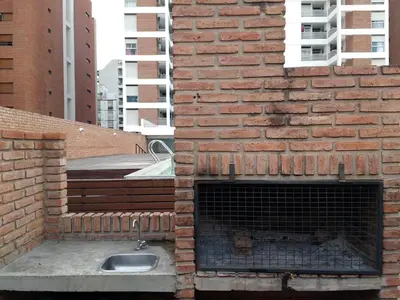 a brick wall with a sink and a fireplace at Jardines del Boulevard 6 in Cordoba
