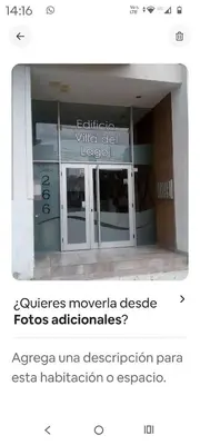 a picture of a building with a glass door at Monoambiente Centro villa Carlos Paz in Villa Carlos Paz