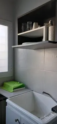 a kitchen with a sink and a green towel at aleyluna in Berrotarán
