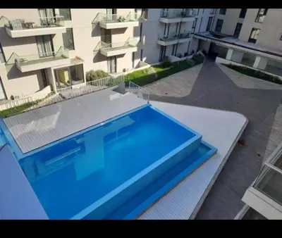 a large blue swimming pool on top of a building at Sam Lake 3 in Villa Carlos Paz