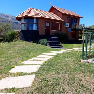 a house with a stone walkway in front of it at Sierra madre 2 in El Rincón