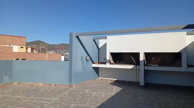 a building with an open window on the side of it at Exelente departamento en Carlos Paz in Villa Carlos Paz