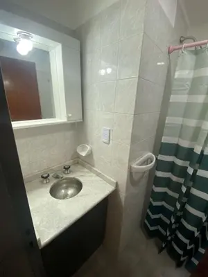 a bathroom with a sink and a shower at Departamento cómodo en Cordoba Capital in Cordoba