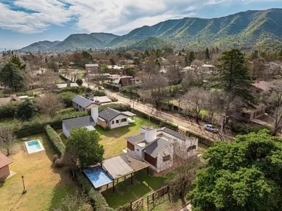 an aerial view of a village with mountains in the background at Cabañas Montecarlo 2 in Santa Rosa de Calamuchita