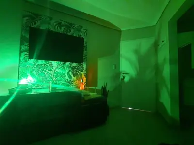 a living room with a flat screen tv on a wall at Terra Zión in Cordoba