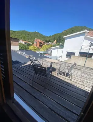 a view from a window of a deck with benches at Lo de Alicia 3 in Villa Carlos Paz
