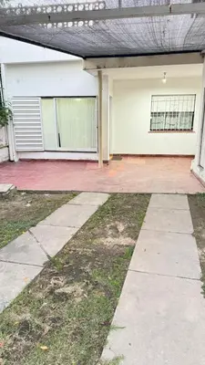 an empty driveway in front of a house at Habitación con baño zona cucú 2 personas in Villa Carlos Paz