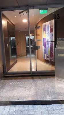 an entrance to a building with a glass door at Departamento Nuevo centro shopping in Cordoba