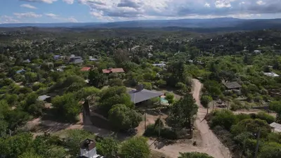 an aerial view of a village with a house and trees at Casa Villa Carlos paz in Villa Carlos Paz