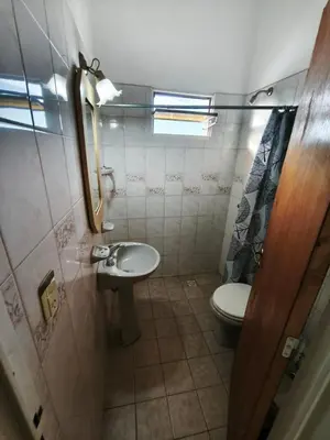 a small bathroom with a toilet and a sink at Dpto Villa Carlos Paz max 5 personas in Villa Carlos Paz