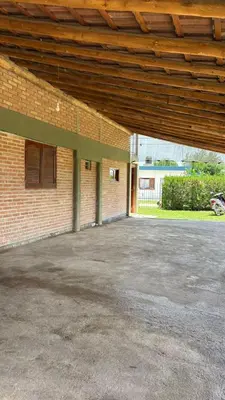 an empty parking lot in front of a brick building at Departamento Vilma Planta Baja Brochero in Villa Cura Brochero