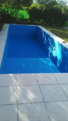a blue cover on a concrete slab with trees in the background at Casa Potrero de Garay in La Estancia