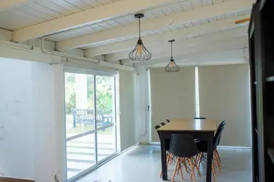 a dining room with a table and chairs at Casa Potrero de Garay in La Estancia