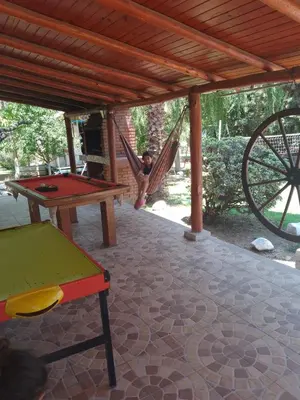 a little girl playing in a hammock in a playground at casa para 12 personas en bialet in San Roque