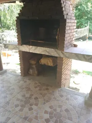 an outdoor brick oven with a brick floor at casa para 12 personas en bialet in San Roque