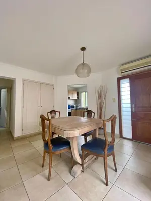 a dining room with a wooden table and chairs at Departamento Nuñez in Cordoba
