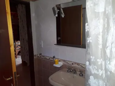 a bathroom with a sink and a mirror at Solares LOFT in Mina Clavero