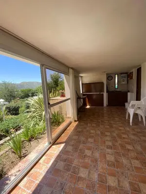 a large room with a large window and a view at Bendecida in San Antonio de Arredondo